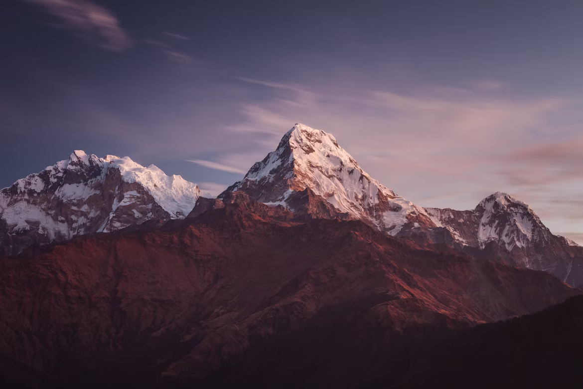 Panoramic view of snow-capped Annapurna South and Hiunchuli peaks from a lodge balcony in Ghorepani.