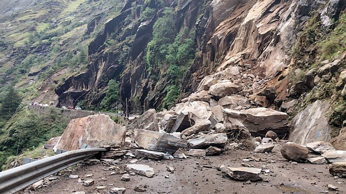 A recent mudslide block blocking a rugged highway or trekking road in rural Nepal.