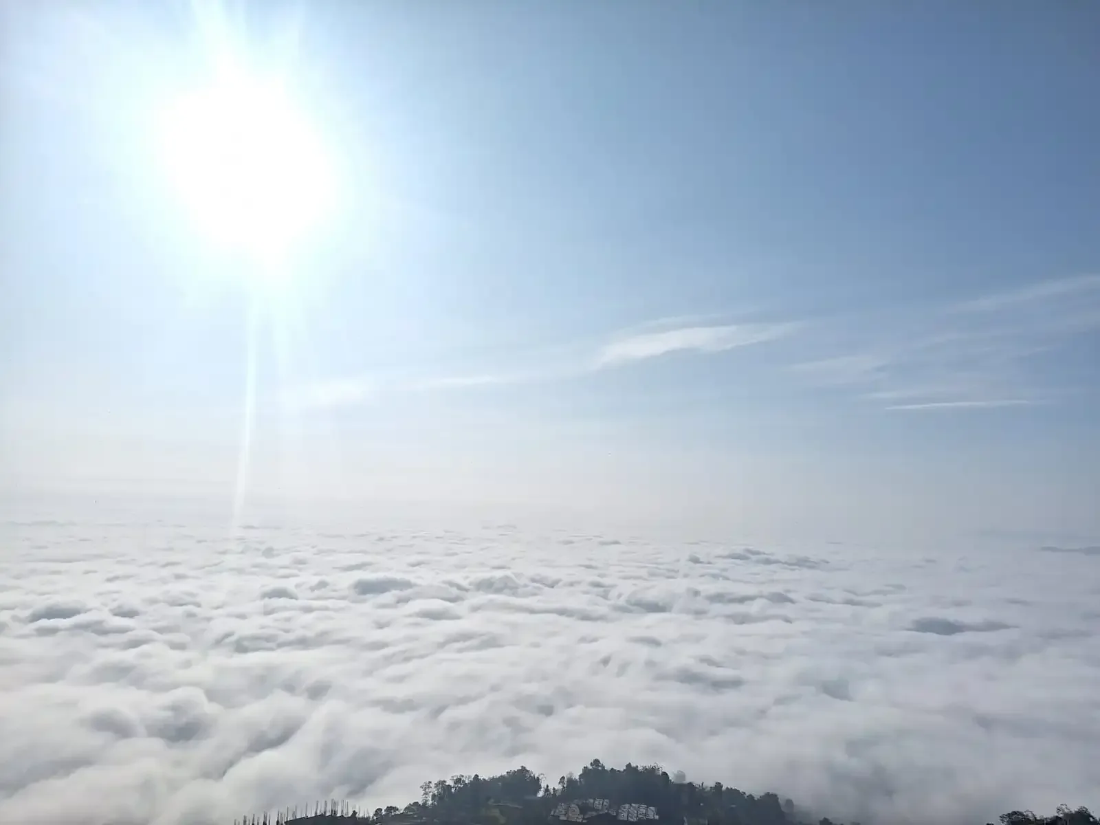 Golden sunrise above the clouds viewed from Sarangkot viewpoint in Pokhara